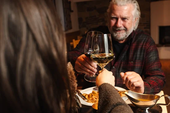 Guests toasting with white wine.