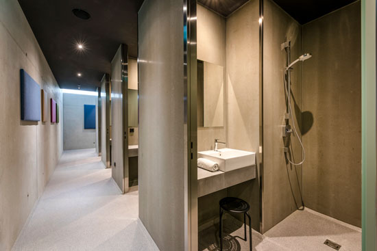 Interior view of shower cubicles in the larger sanitary building. Interior view of shower cubicles in the larger sanitary building.