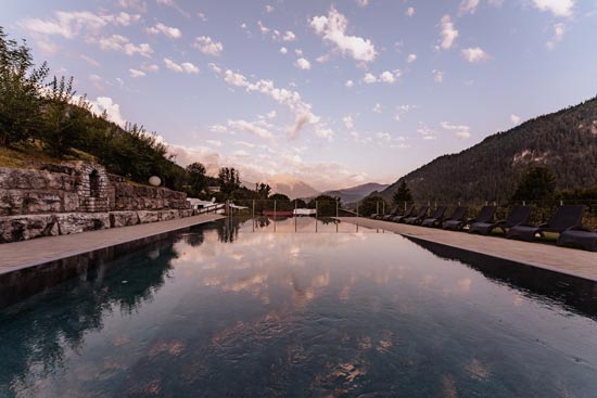 Summer mornings by the pool with a view of the Berchtesgaden mountains. Summer mornings by the pool with a view of the Berchtesgaden mountains.